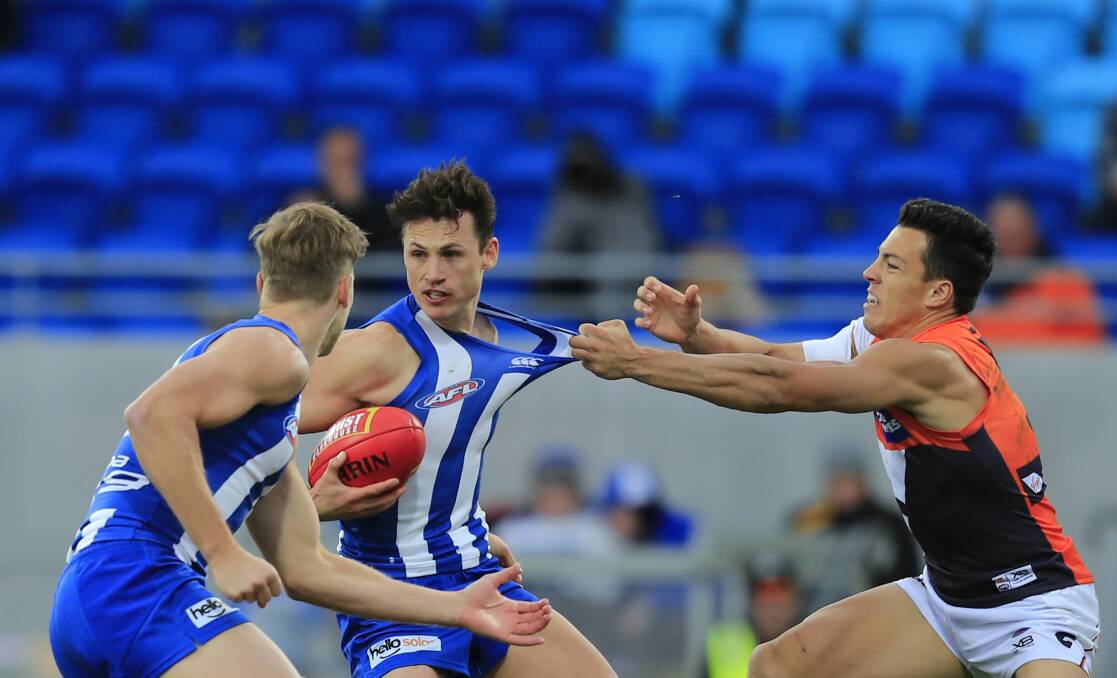 Giant statement: Empty seats form the backdrop as North Melbourne take on Greater Western Sydney at Beelerive Oval in May, 2018. Just 7194 supporters attended the game, Tasmania's lowest AFL crowd. Picture: AAP
