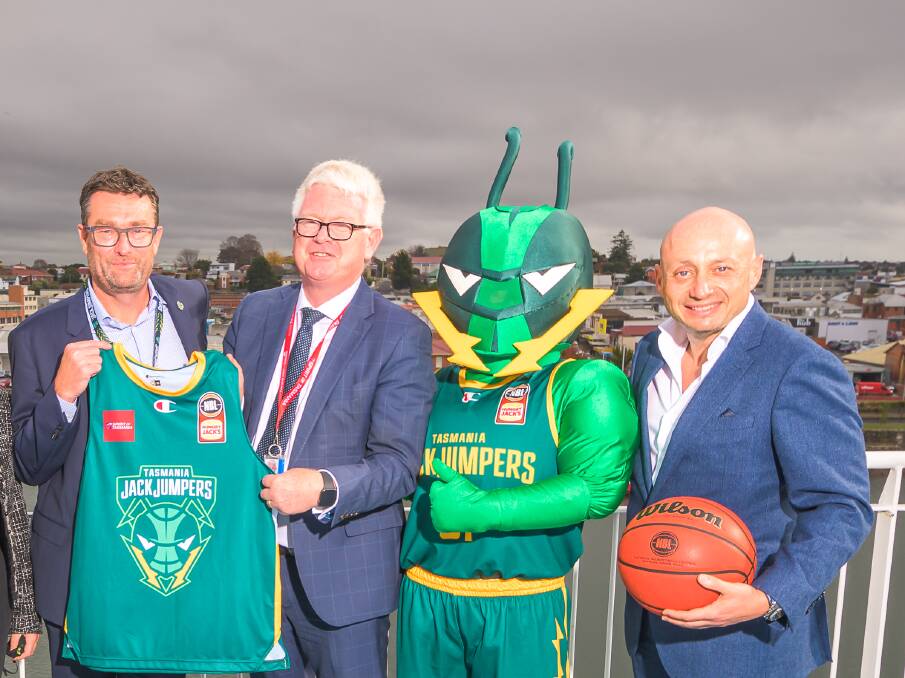 Ant's nest: Jack the Jumper gets stuck in with the bosses of the JackJumpers, Simon Brookhouse, Spirit Of Tasmania, Bernard Dwyer, and NBL, Larry Kestleman, at last week's press call. Picture: Simon Sturzaker