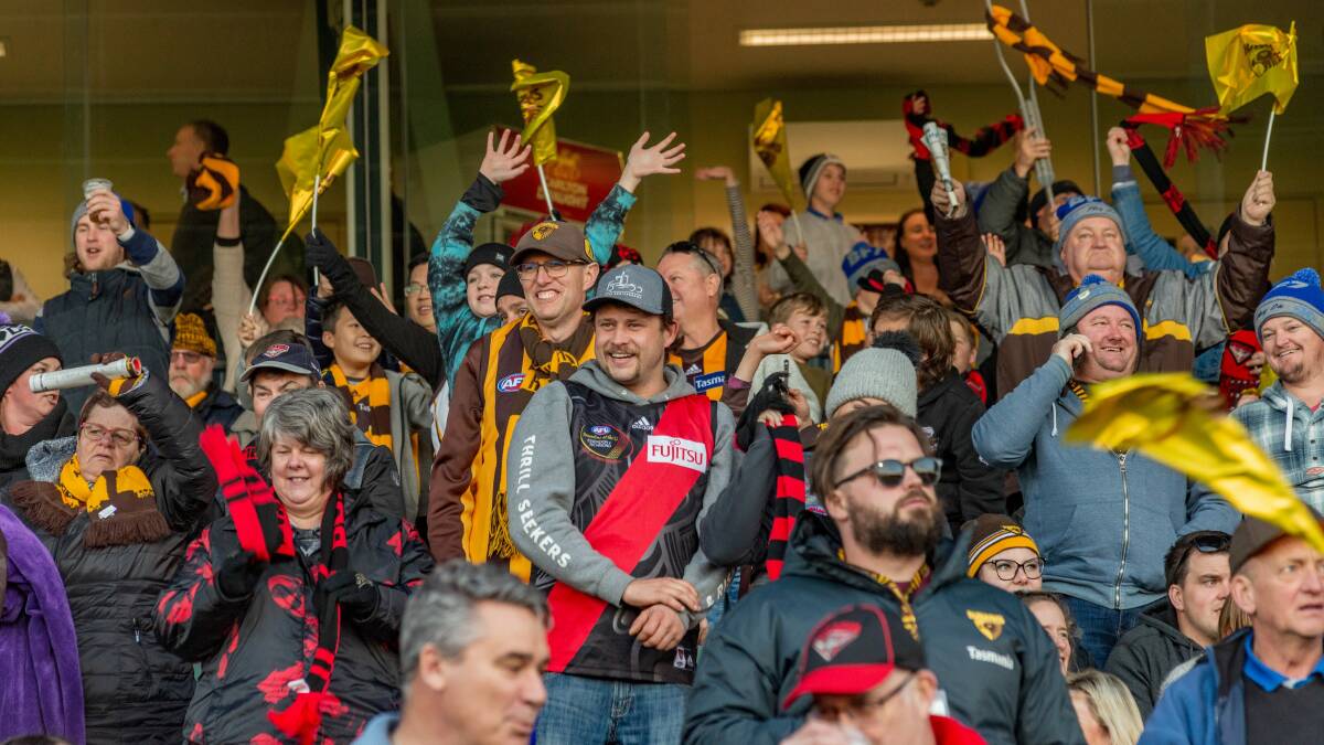 DON AND DUSTED: Hawthorn and Essendon fans pile in together to enjoy Sunday's AFL match at UTAS Stadium. Picture: Phillip Biggs