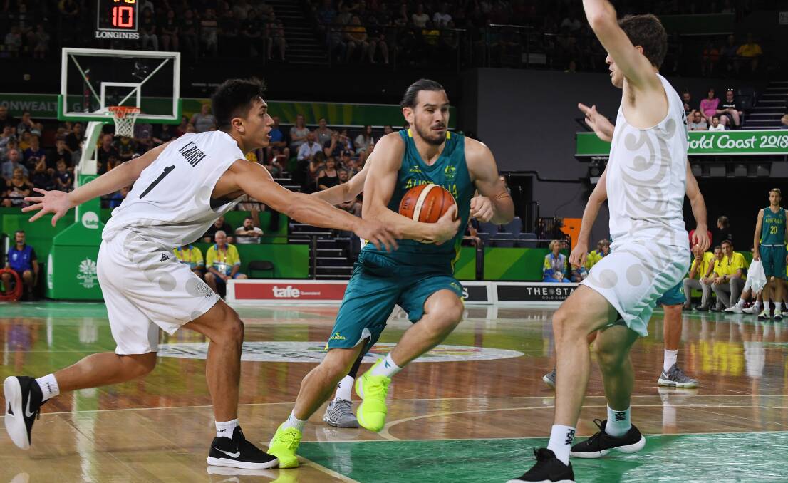 Floored: Chris Goulding playing for the Boomers. Picture: AAP