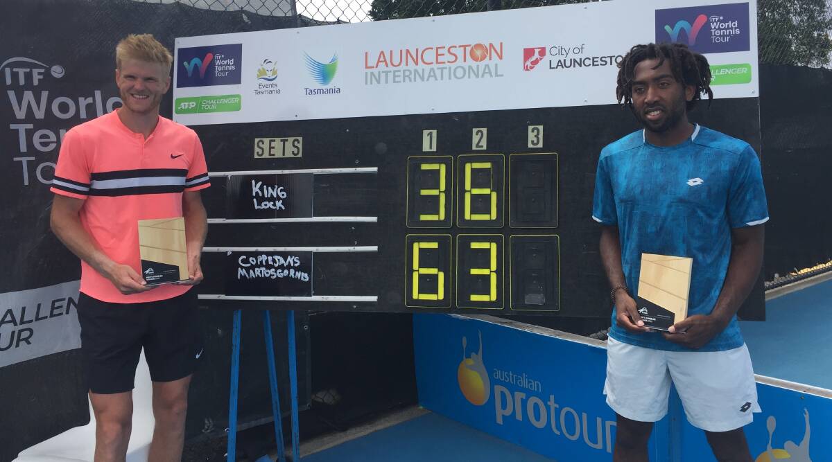 Locked in: Benjamin Lock and Evan King enjoy their men's doubles title in Launceston. Picture: Rob Shaw