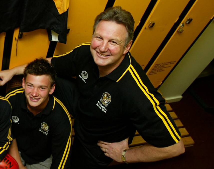 Family pride: Michael Roach with his son Tommy after being drafted to Richmond in 2004. Picture: The Age
