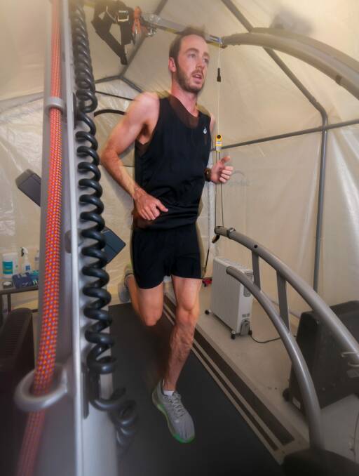 NO SWEAT: Jake Birtwhistle training in a makeshift heat chamber at the Tasmanian Institute of Sport. Picture: Phillip Biggs