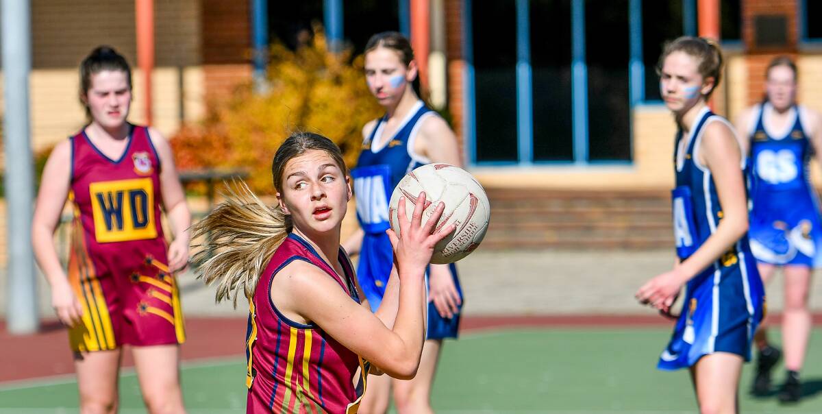 Rivalry round: Aprille Crooks leads the charge for Riverside against Kings Meadows in the NHSSA senior firsts netball grand final. Picture: Scott Gelston