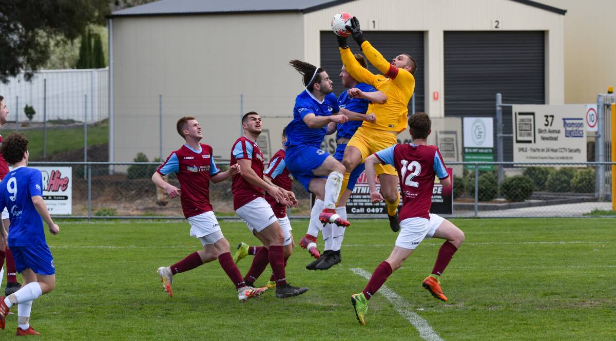 FLYING HIGH: Northern Rangers goalkeeper Zach Chugg climbs over the pack in his side's 5-0 Northern Championship win away to Launceston United. Picture: Paul Scambler