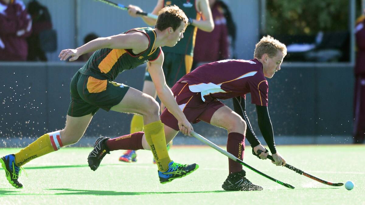Cross sticks: Tasmania and Queensland compete in the national under-18 men's hockey championship at St Leonards in July, 2016.