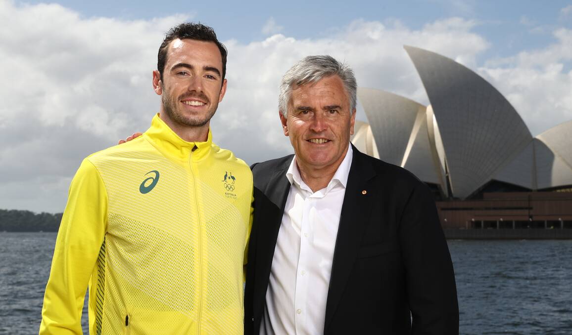 LOOKING SHARP: Jake Birtwhistle receives his Olympic uniform from Chef de Mission and fellow West Tamar resident Ian Chesterman in Sydney on Wednesday. 