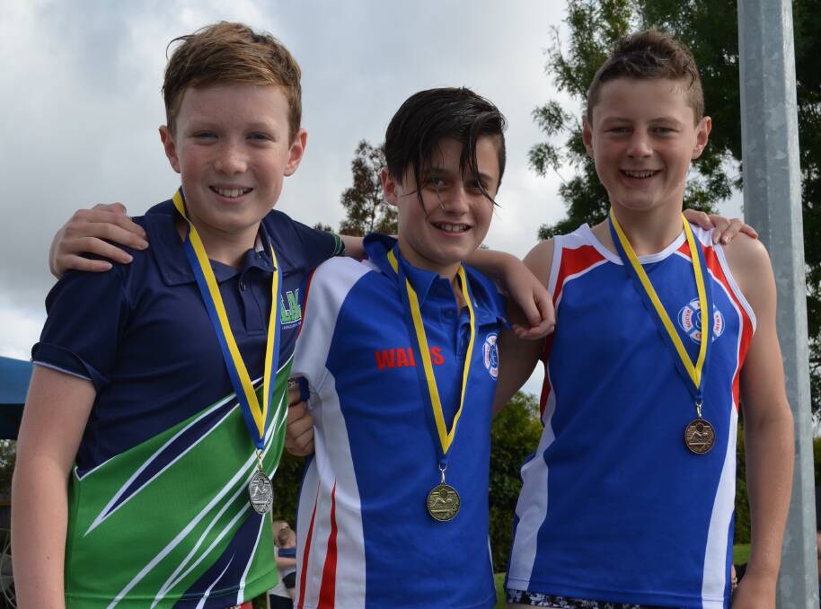 The medallists in the boys' 11-12 years 33m butterfly are Jack Cramp, 11, Noah Wallis, 12, and Tom Heazlewood, 12.