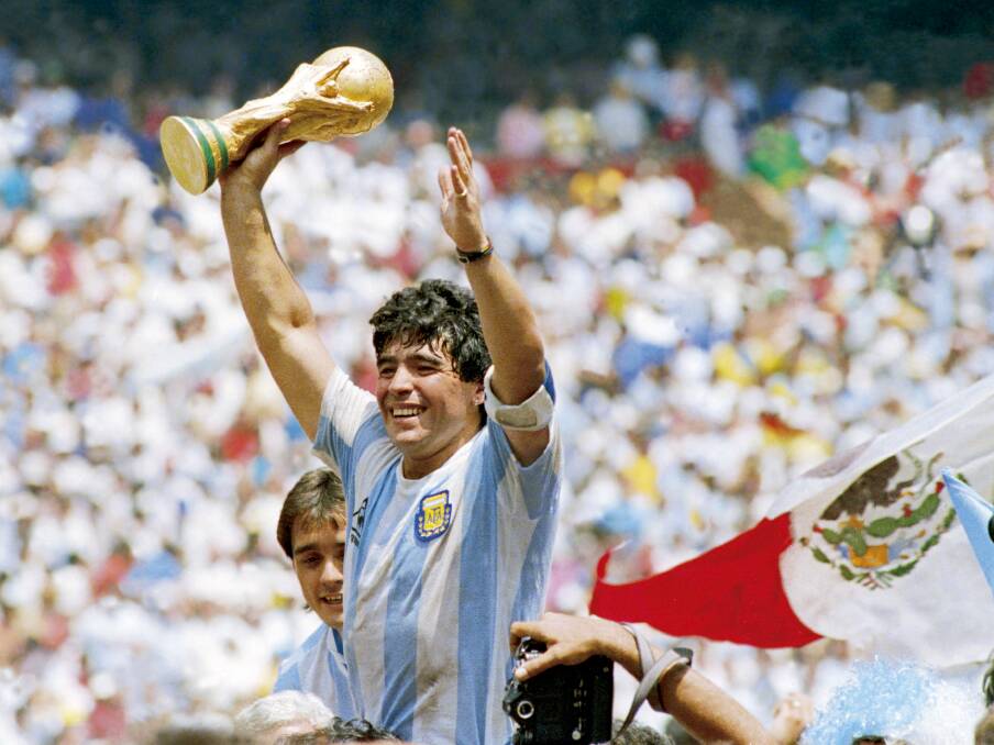 CROWN JULES: Diego Maradona celebrates with the World Cup in 1986. Picture: Getty Images