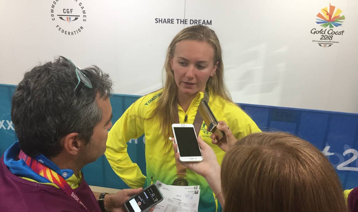 Green and gold: Launceston's Ariarne Titmus, performing media commitments at the 2018 Commonwealth Games, will be on duty again at the Tokyo Olympics. Picture: TIS
