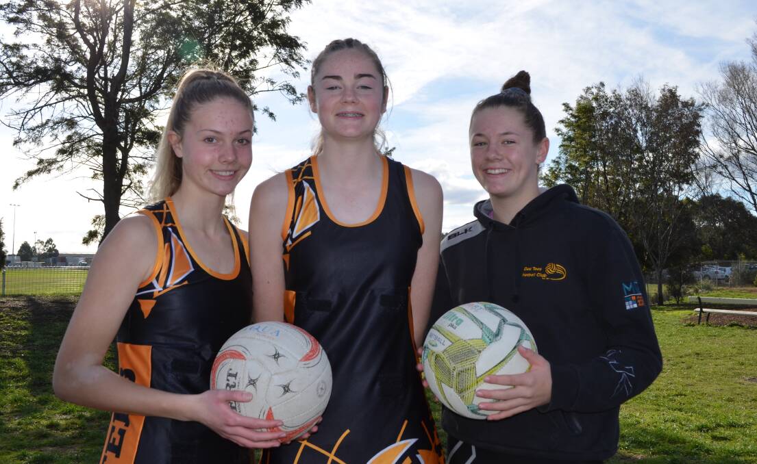 On the ball: Hannah Crawford, Olive Morris (centre) and Ellie Marshall reflect on their experiences training with the state 15 and under netball team. Picture: Wendy Shaw