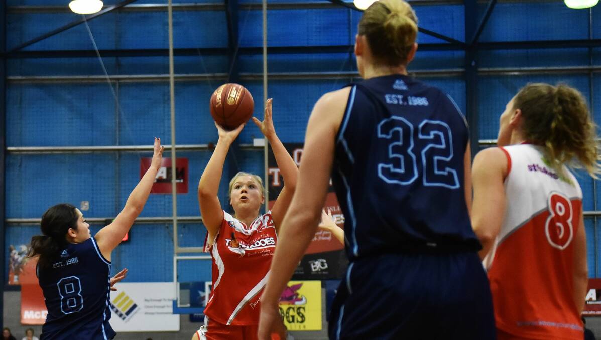 Looking up: Tayla Roberts shoots in the Torns' match against Frankston last month. Picture: Scott Gelston