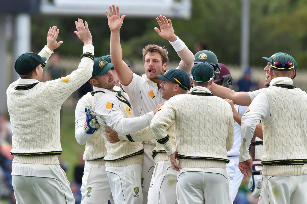SOUTHERN COMFORTS: James Pattinson leads the celebrations when Australia played West Indies in Hobart in 2015.