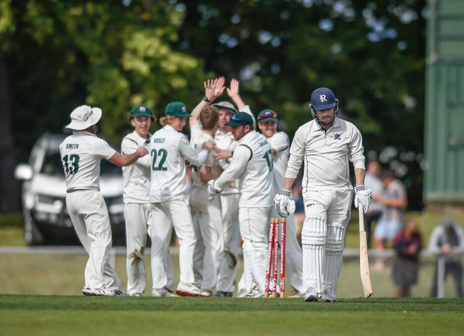 HIGH FIVES: Launceston celebrate the wicket of Riverside's Matt Kerrison. Picture: Craig George