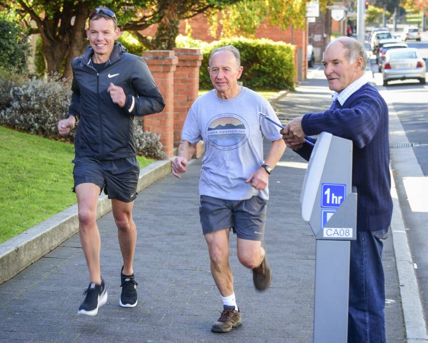 No parking: Runners Zane Carr and Richard Pickup get in some training watched by Lilydale Lope race founder Brian Baxter. Picture: Paul Scambler