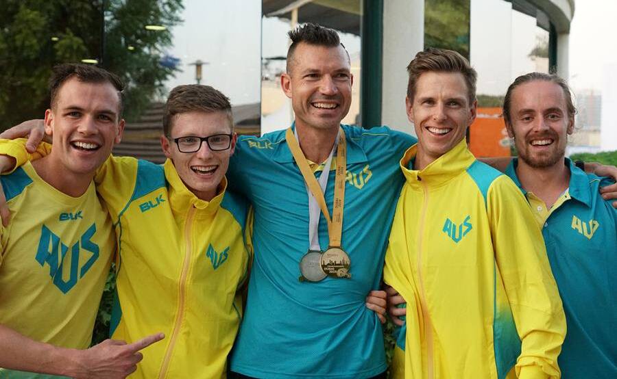 Tasmanian runner Deon Kenzie (left) enjoying the world championship experience with his Australian teammates.
