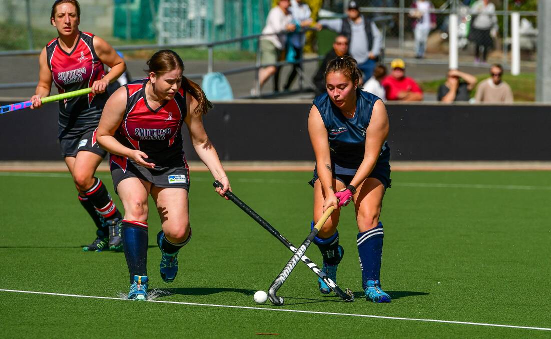Cross sticks: Launceston City's Molly Lewis keeps her Smithton opponent at bay during the Greater Northern League women's hockey match. Picture: Scott Gelston. 