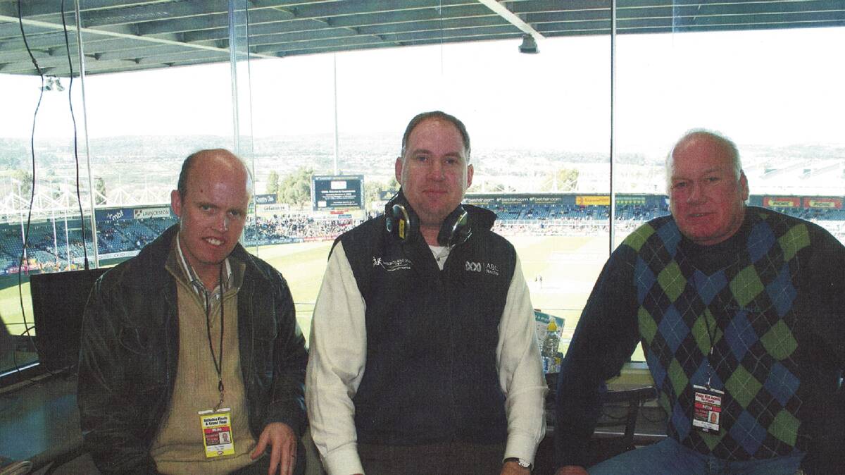 Milestone moment: Newlinds (centre) with Dan Lonergan and Mark Maclure in Launceston for Shane Crawford's 300th match in 2008.
