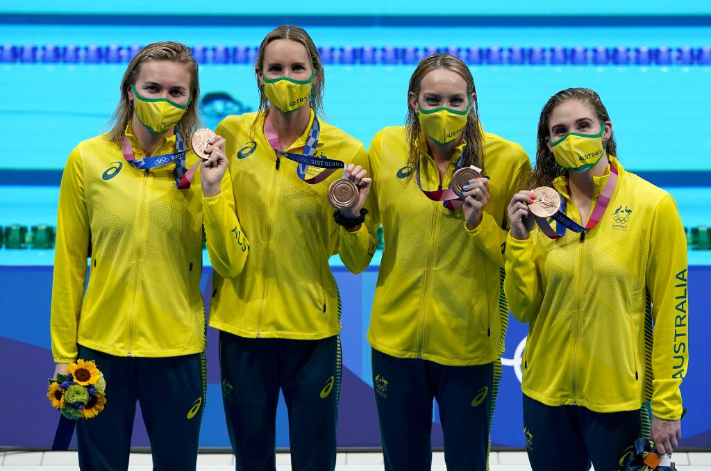 Bronzed Aussies: Ariarne Titmus, Emma McKeon, Madison Wilson and Leah Neale with their bronze medal in the womens 4x200m freestyle relay in Tokyo. Picture: AAP