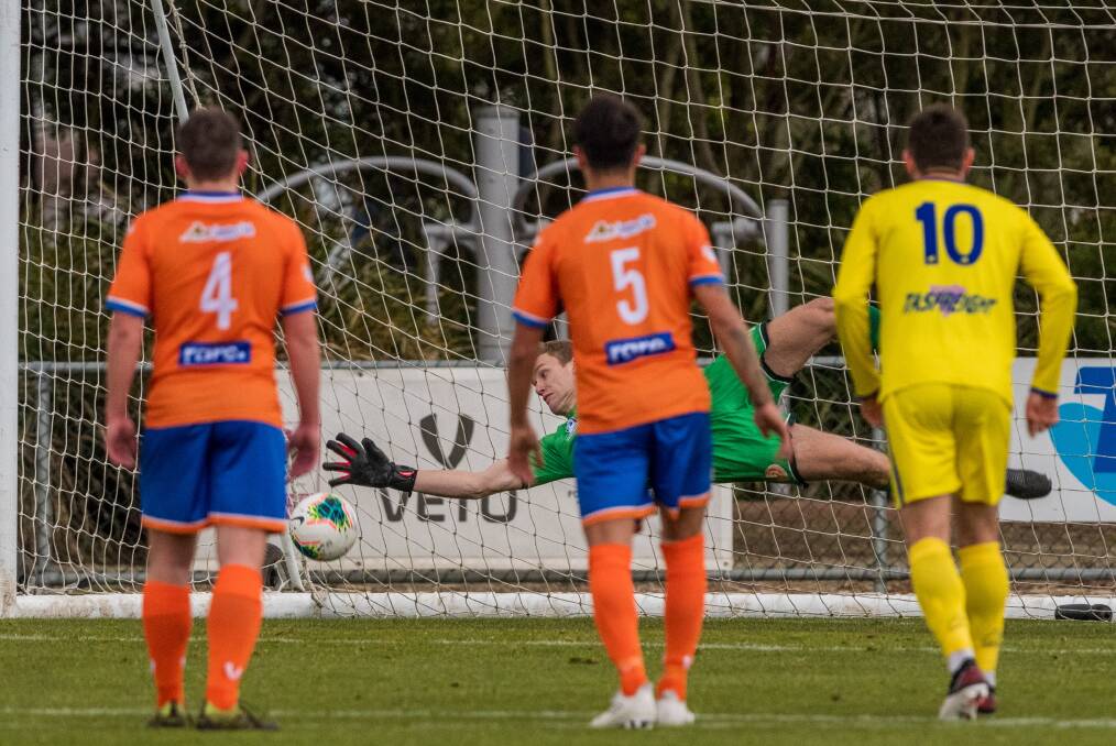 Penalty rates: Riverside and Devonport players look on as Jarrod Hill dives to keep out Eddie Bidwell's penalty. Picture: Phillip Biggs