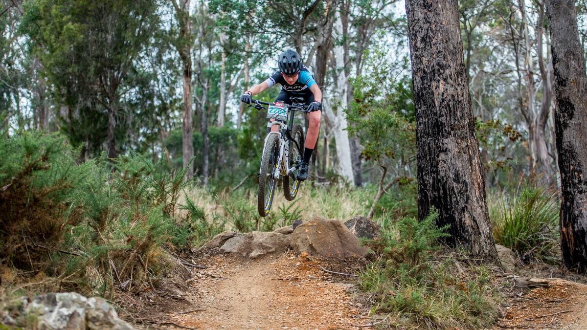 AIMING HIGH: Izzy Flint in high-flying action at the 2017 Tasmanian All-Schools Mountain Bike Championships at Kate Reed. 