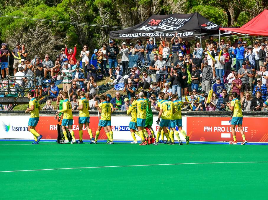 Australian players acknowledge the crowd after defeating Germany in Hobart in 2019. 