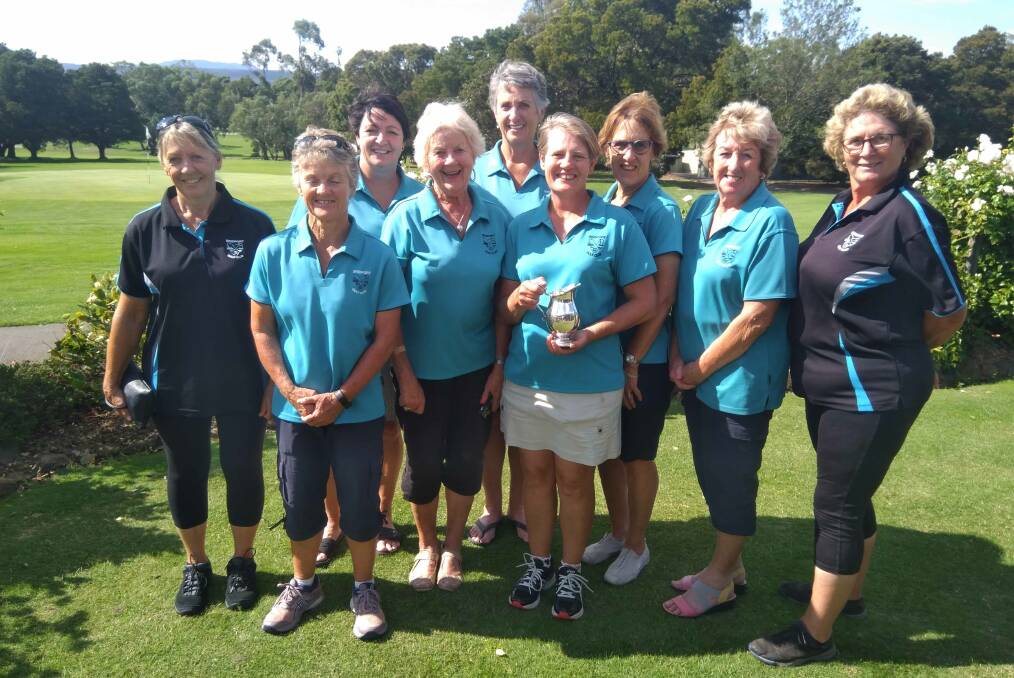 Port in a storm: Trish Nichol (with the cup) and her Bridport clubmates celebrate Country Week victory.