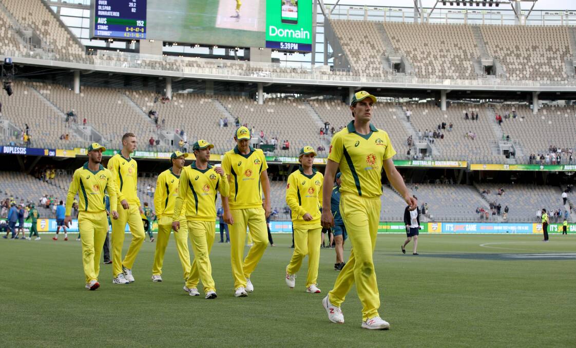 Poor reception: Australian players depart a sparsely-filled Optus Stadium in Perth after losing the first One-Day International against South Africa on Sunday. Picture: AAP 