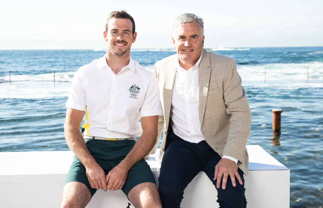 PLAIN SAILING: Canoeist Daniel Watkins models the Australian Olympic uniform with Chef de Mission and fellow Tasmanian Ian Chesterman. Picture: Australian Olympic Committee