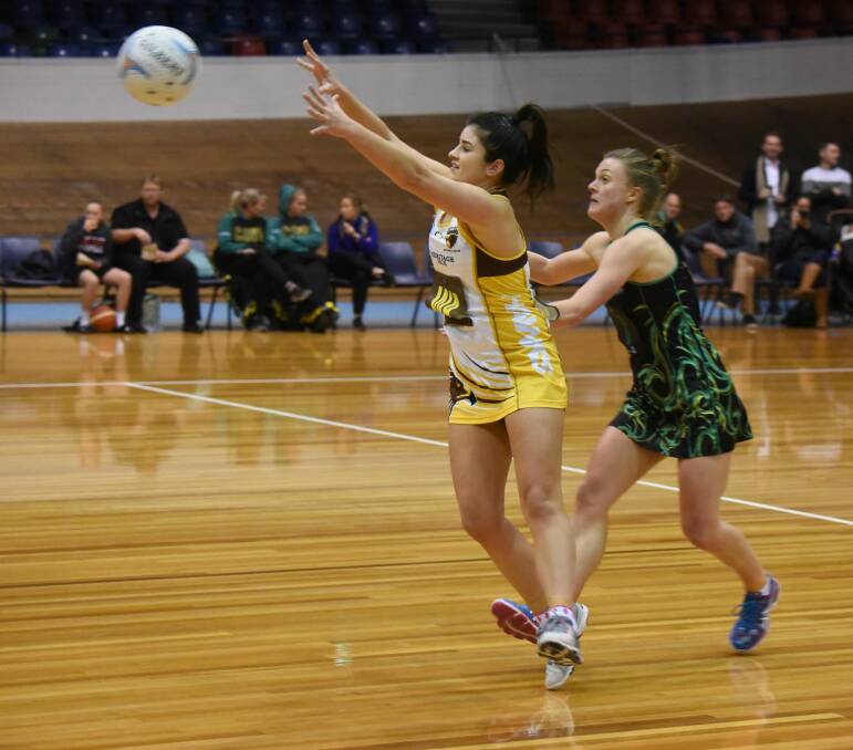 Mid strength: The mid-court match-up between Steph Walker, of the Hawks, and Cavaliers' Lucy Dennis will be pivotal to Saturday's State League derby. Picture: Paul Scambler