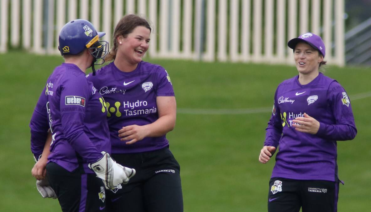 TEEN IDOL: Ruth Johnston celebrates one of her four wickets with century-maker Rachel Priest and Sasha Moloney. Picture: Rick Smith