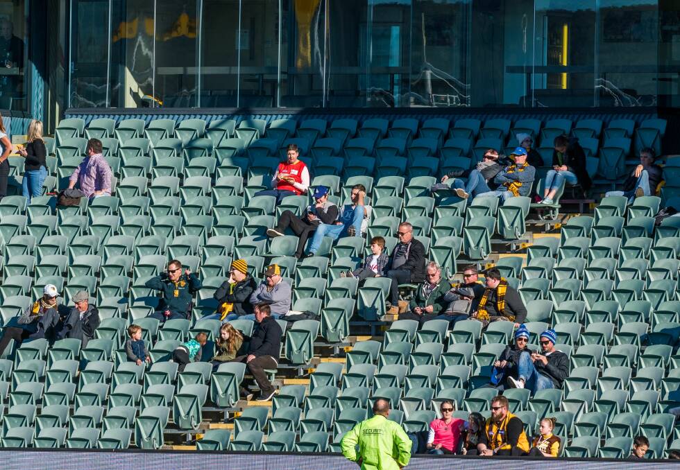 Slim pickings: Swathes of empty seats greeted Hawthorn and Gold Coast for their match in Launceston on Saturday. Picture: Phillip Biggs
