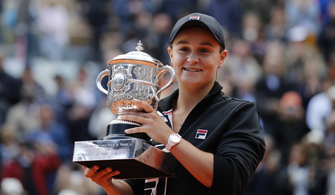 Clay caught: Ashleigh Barty celebrates winning the French Open women's final at Roland Garros stadium in Paris. Picture: AP 