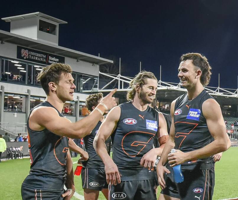 Point proven: GWS players celebrate their one-point win in Launceston last month.