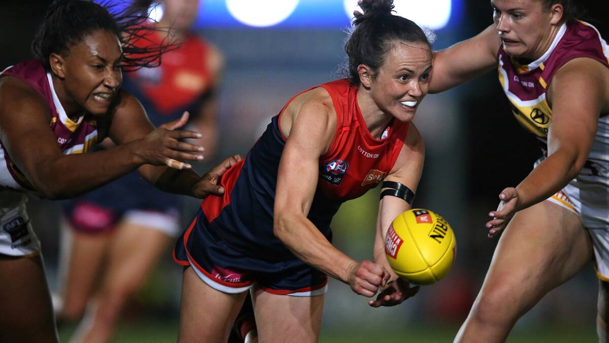 DROPPED THE BALL: Daisy Pearce handballs out of defence for Melbourne last year.