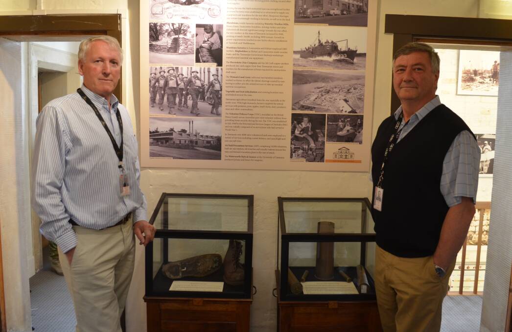 CONTRIBUTION: Volunteers John Macleod and Gary Durrant showcase the Army Museum of Tasmania's new World War II exhibit. Picture: Emily Jarvie