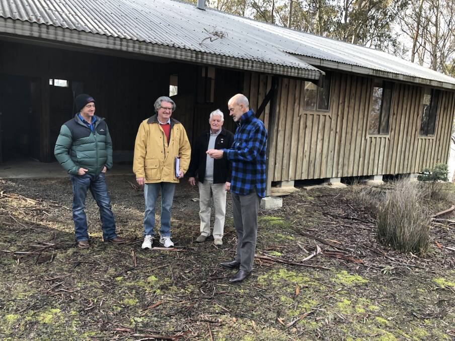 Veteran representatives Philip DeBomford, Terry Roe, Kerry Wise and Veterans' Affairs Minister Guy Barnett in front of the former Parks and Wildlife Service shack at Lake Sorell which be converted into a retreat for veterans. Picture: supplied