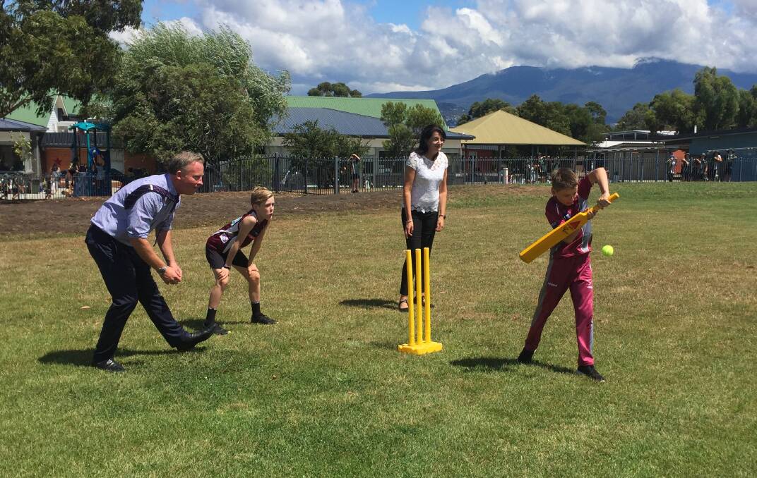 HIT: Premier Will Hodgman and Minister for Sport and Recreation Jacquie Petrusma play cricket with Howrah Primary School students at the Ticket to Play launch. Picture: Emily Jarvie. 