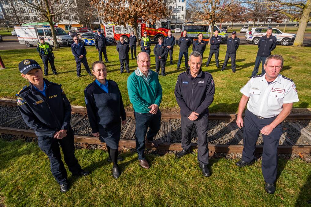 MESSAGE: Tasmania Police Acting Commander Northern District Ruth Orr, State Emergency Service regional manager north Mhairi Revie, Police, Fire and Emergency Management Minister Mark Shelton,
Launceston station officer Heath Bracey, Ambulance Tasmania regional duty manager Rick Shegog, with emergency workers in Launceston. Picture: Phillip Biggs 