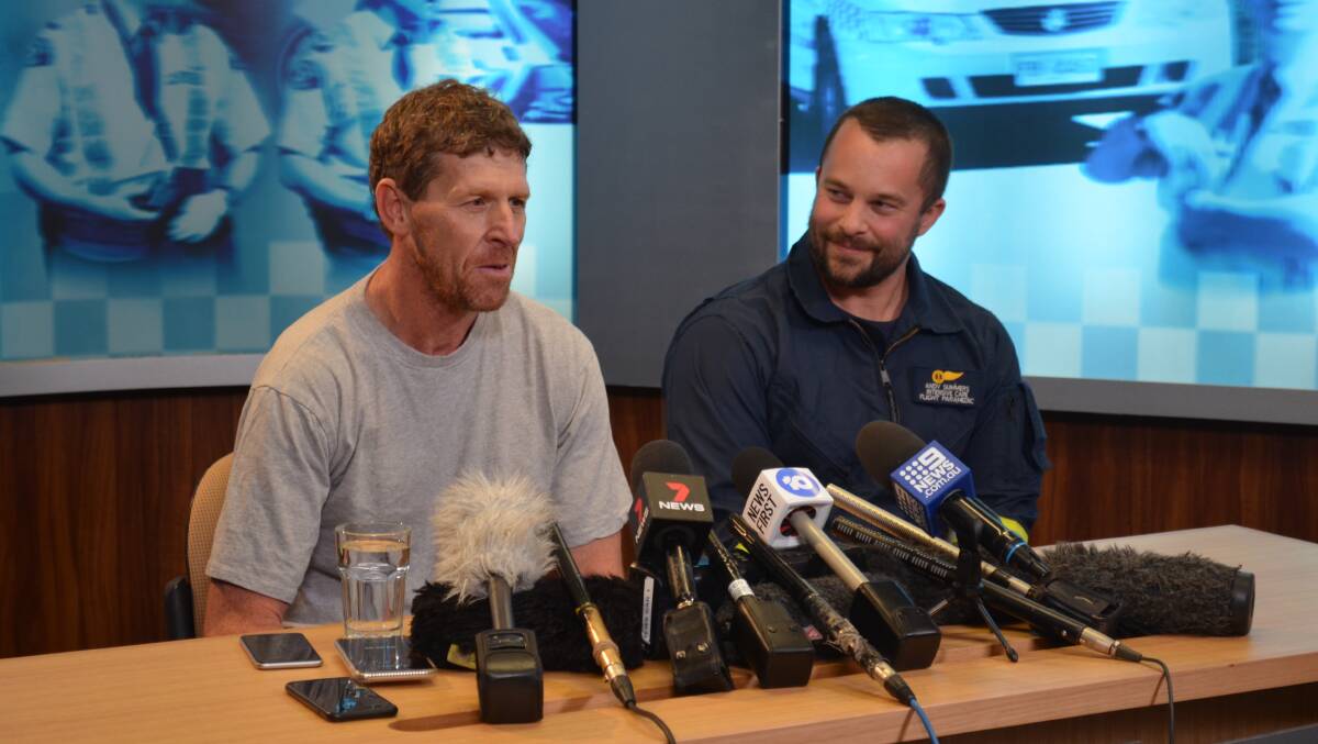 FOUND: Bushwalker Michael Bowman and Ambulance Tasmania flight paramedic Andy Summers tell the media how Mr Bowman survived for over a week in harsh and snowy conditions with limited supplies. Picture: Emily Jarvie 