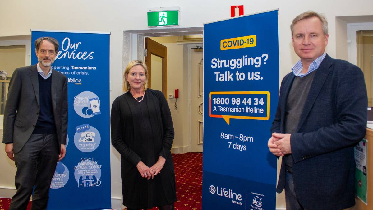 University of Tasmania Vice-Chancellor Rufus Black, Lifeline Tasmania chief executive Debbie Evans and Education Minister Jeremy Rockliff at Lifeline's Hobart call centre. Picture: supplied 