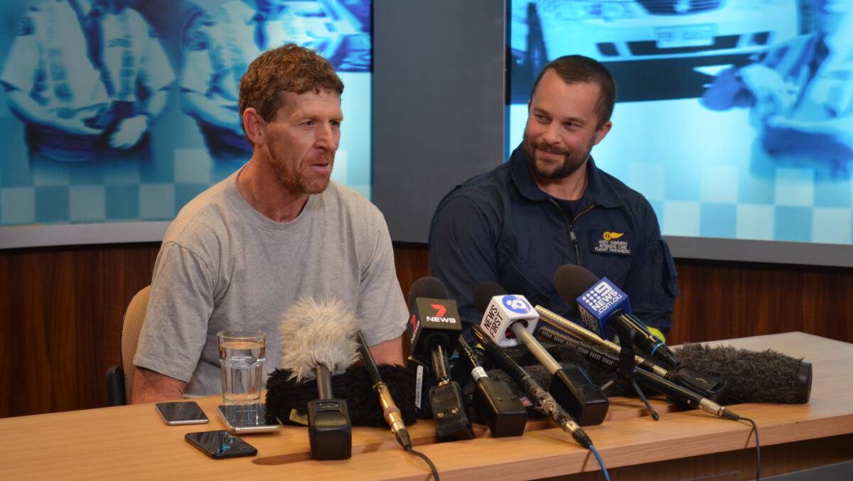 SAFE: Missing hiker Michael Bowman and Ambulance Tasmania flight paramedic Andy Summers. Picture: Emily Jarvie 