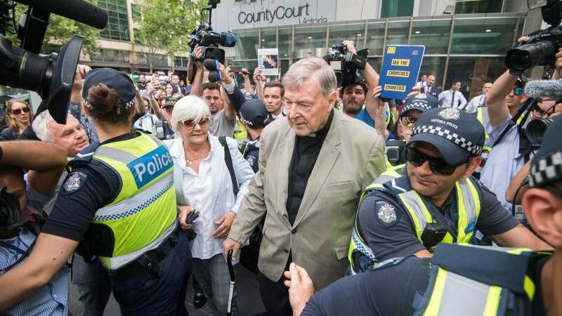 GUILTY: Cardinal George Pell leaving the County Court in Melbourne on Tuesday. 
