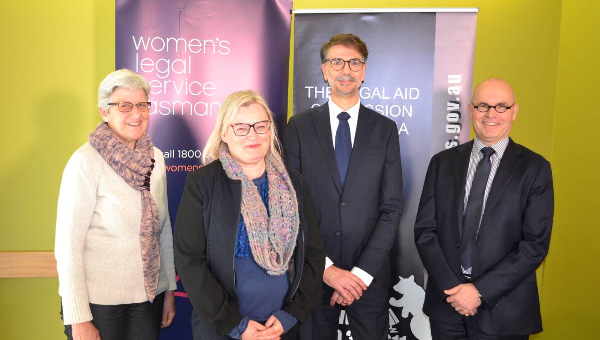 UNDERSTANDING: Women's Legal Service Tasmania chairwoman Sonia Shimeld, WLST chief executive Yvette Cehtel, Legal Aid Commission of Tasmania director Vincenzo Caltabiano and LACT chairman Patrick Lunn at the signing. Picture: supplied 