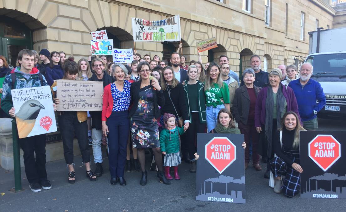 SUPPORT: Greens Franklin MHA Rosalie Woodruff and Greens leader Cassy O'Connor stand with Tasmanians who attended Parliament House while the motion was debated. Picture: Emily Jarvie 