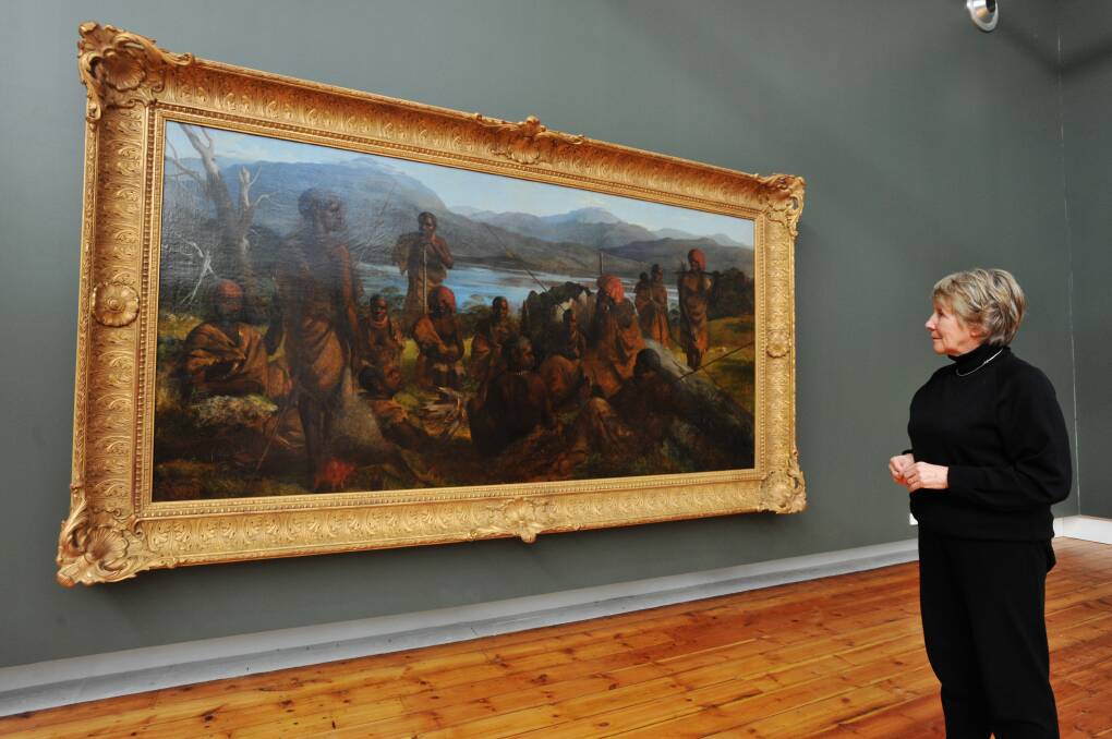 QVMAG colonial gallery curator Yvonne Adkins with a 19th century piece by Robert Dowling.