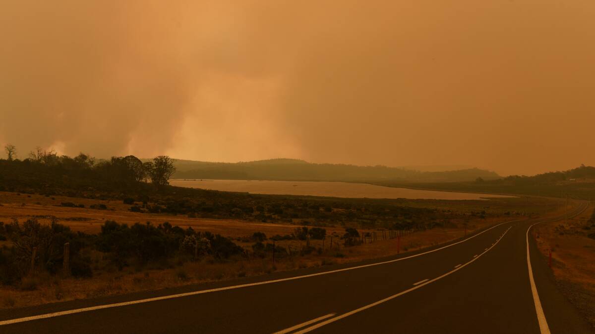 WORST TO COME: Thick smoke blankets the sky near Shannon Lagoon at Miena on Tuesday. Picture: Paul Scambler