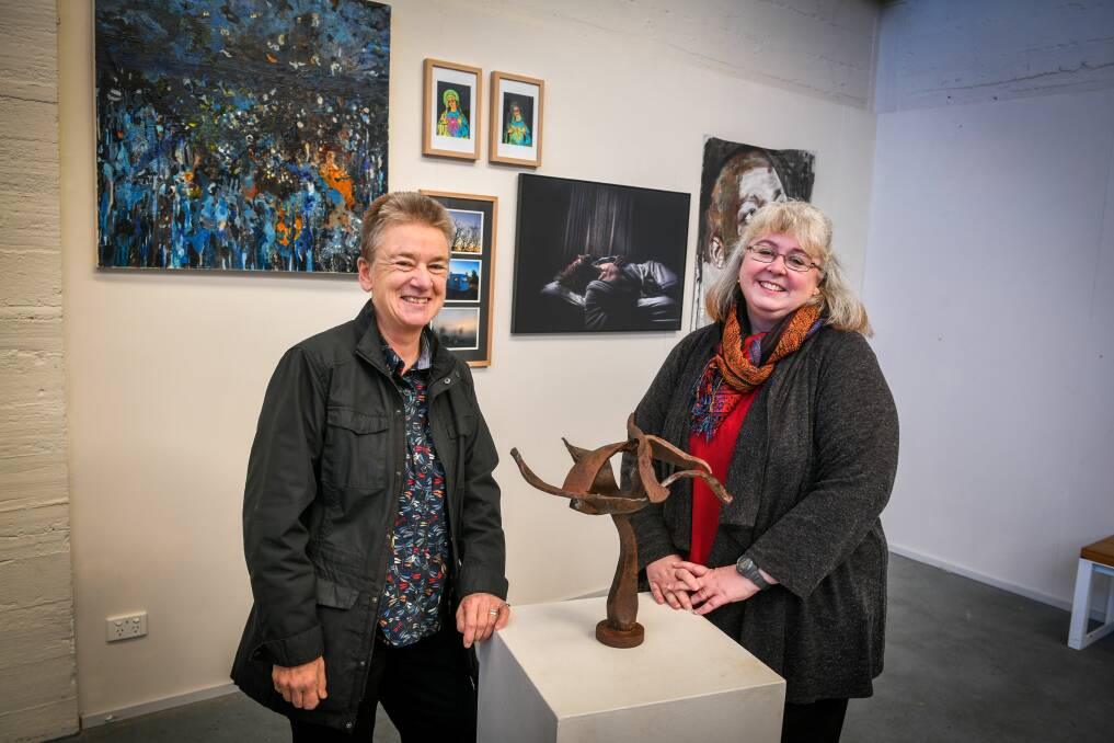 Enterprising Aardvark organisers Rachel and Lisa with some of the artwork available at the Sawtooth. Picture: Paul Scambler
