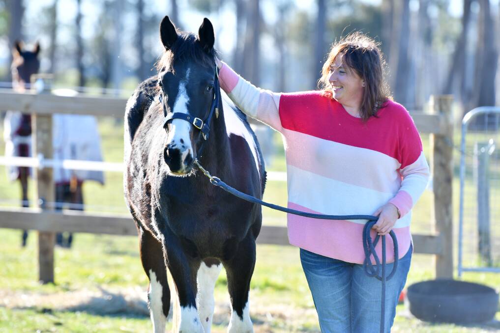 Connection: Jackie spends time with her young horse Douglas at her Thirlstane property. Picture: Brodie Weeding.