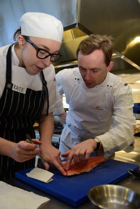 PRECISION: Former Rockpool head chef Phil Wood with cookery student Kate Brown. Picture: Paul Scambler